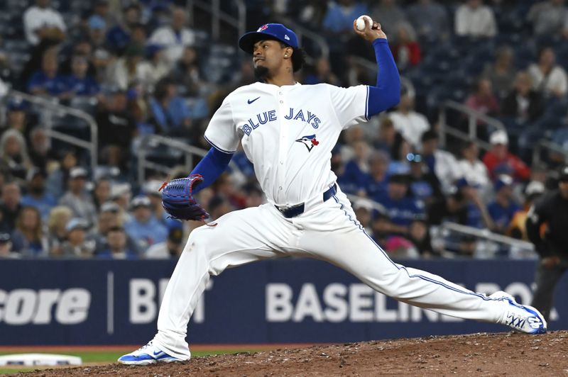 Toronto Blue Jays pitcher Genesis Cabrera throws to a Philadelphia Phillies batter in the eighth inning of a baseball game in Toronto on Tuesday Sept. 3, 2024. (Jon Blacker/The Canadian Press via AP)