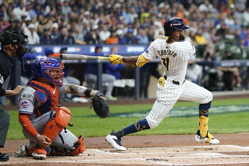 Milwaukee Brewers' Jackson Chourio hits a single during the first inning of Game 3 of a National League wild card baseball game against the New York Mets Thursday, Oct. 3, 2024, in Milwaukee. (AP Photo/Morry Gash)