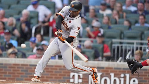 San Francisco Giants' LaMonte Wade Jr. (31) hits a solo home run in the fifth inning of a baseball game against the Atlanta Braves, Tuesday, July 2, 2024, in Atlanta. (AP Photo/Brynn Anderson)