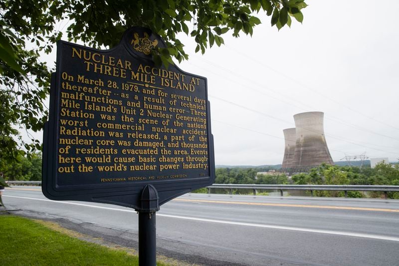 FILE - Shown are the unit 2 cooling towers at the Three Mile Island nuclear power plant in Middletown, Pa., Monday, May 22, 2017. (AP Photo/Matt Rourke, File)