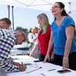 Revival Fellowship volunteers Janie Booth, left, and Lucky Harutunian register voters during a Comeback California Tour event, Saturday, Sept. 21, 2024, in Menifee, Calif. (AP Photo/Zoë Meyers)