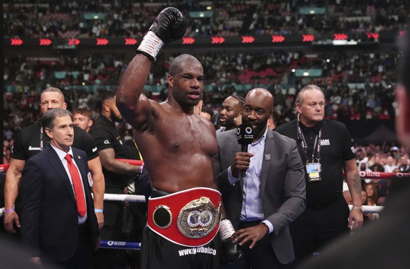 Daniel Dubois celebrates victory against Anthony Joshua, not pictured, in the IBF World Heavyweight bout at Wembley Stadium, in London, Saturday, Sept. 21, 2024. (Bradley Collyer/PA via AP)