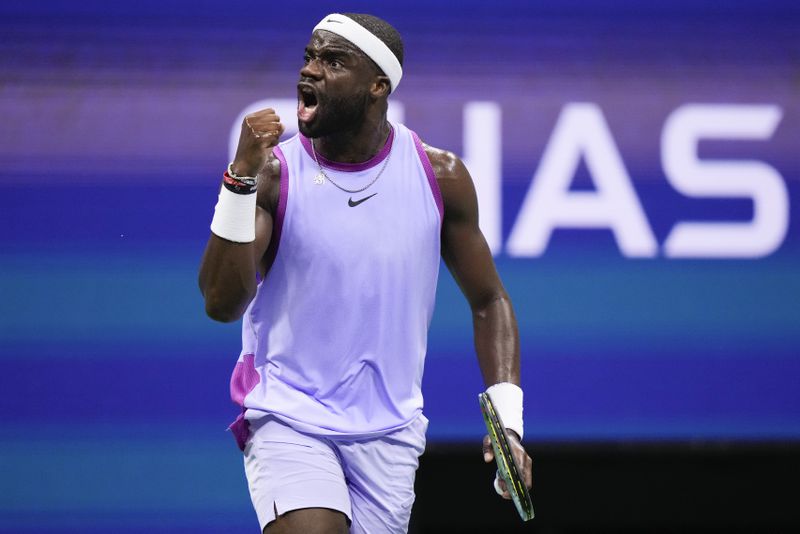 Frances Tiafoe, of the United States, reacts after scoring a point against Taylor Fritz, of the United States, during the men's singles semifinal of the U.S. Open tennis championships, Friday, Sept. 6, 2024, in New York. (AP Photo/Frank Franklin II)