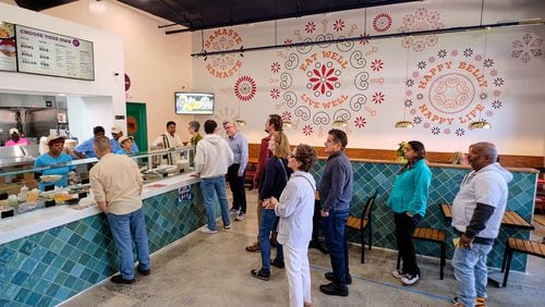 You move down the cafeteria-style line at the counter of Sankranti Indian Kitchen and pick the ingredients for your customized curry bowl. Courtesy of Brandon Amato