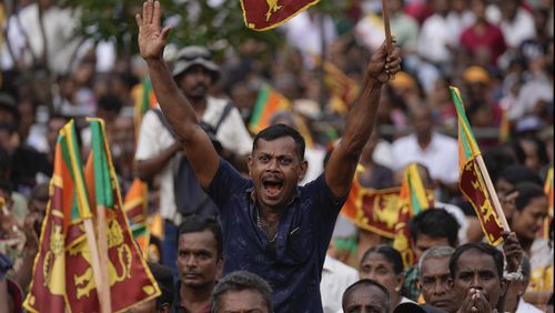 A supporter of Sri Lanka's president Ranil Wickremesinghe cheers during a public rally in Colombo, Sri Lanka, Wednesday, Aug. 28, 2024. (AP Photo/Eranga Jayawardena, File)