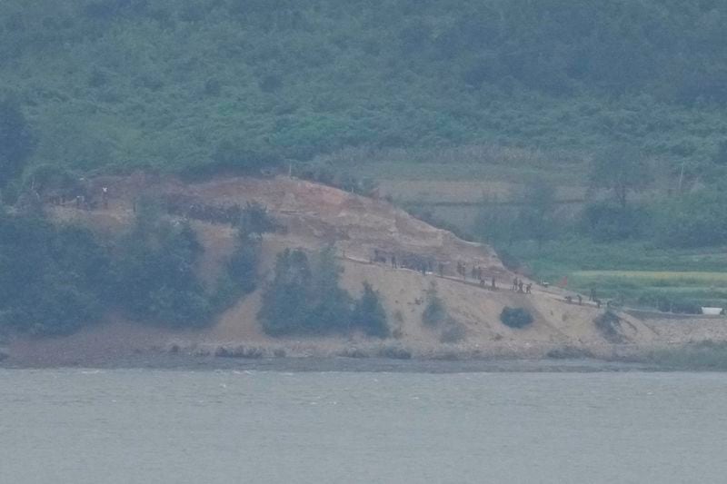 North Korean, along the military fences, are seen from South Korea's Paju Thursday, Sept. 5, 2024. (AP Photo/Lee Jin-man)