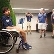 Atlanta Braves greeter Wilson Barron rests in his wheelchair as he works in an elevator lobby before the Braves play the New York Mets at Truist Park, Tuesday, Sept. 24, 2024, in Atlanta. (Jason Getz / AJC)

