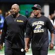 Falcons head coach Raheem Morris and the Pitsburg Steelers head coach Mike Tomlin interact moments before the game on Sunday, Sept. 8, at Mercedes-Benz Stadium in Atlanta. Falcons head coach wears an Apalachee High school shirt to support the recent events that shocked the community in Winder, Ga.
(Miguel Martinez/ AJC)