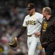 San Diego Padres starting pitcher Joe Musgrove exits the game during the fourth inning in Game 2 of an NL Wild Card Series baseball game against the Atlanta Braves, Wednesday, Oct. 2, 2024, in San Diego. (AP Photo/Gregory Bull)