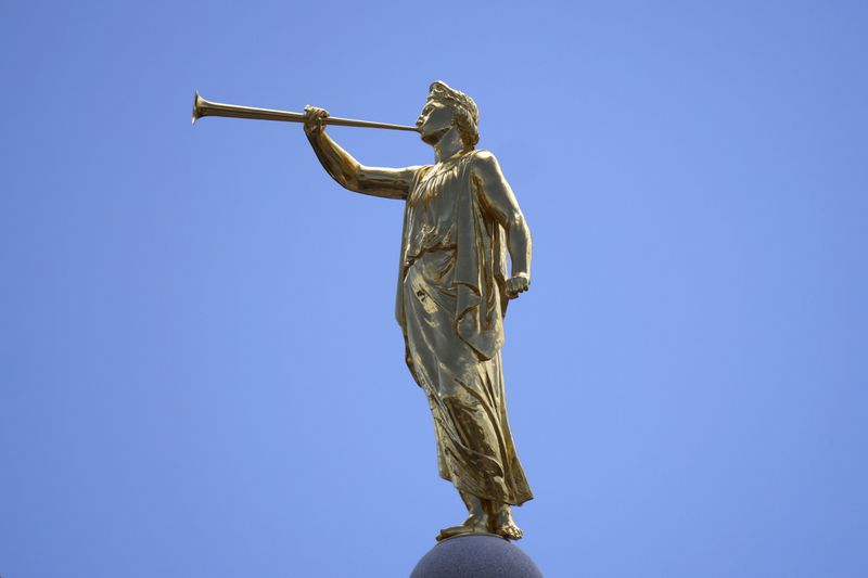 The angel Moroni statue sits atop the Salt Lake Temple of The Church of Jesus Christ of Latter-day Saints at Temple Square during an ongoing renovation project June 17, 2024, in Salt Lake City. (AP Photo/Rick Bowmer)