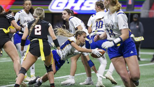 SE Bulloch’s Jaci Kitchings (4) scores the extra-point to make it 14-0 against North Oconee (32) during the Girl’s Flag Football A-4A GHSA State Championship game at Mercedes-Benz Stadium, Monday, December. 11, 2023, in Atlanta. SE Bulloch won 14-0. (Jason Getz / Jason.Getz@ajc.com)