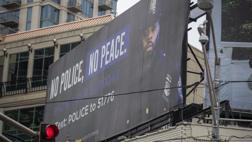 A billboard promoting the need for police officers is displayed at the intersection of Peachtree and East Paces Ferry roads in Buckhead in September. (Alyssa Pointer / Alyssa.Pointer@ajc.com)