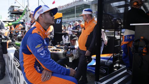 Kyle Larson sits on pit wall before a practice session for the Indianapolis 500 auto race at Indianapolis Motor Speedway, Friday, May 24, 2024, in Indianapolis. (AP Photo/Darron Cummings)