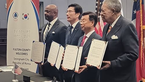 Officials from Seongnam, South Korea, and Fulton County hold copies of formal agreements on cooperation and cultural exchange Monday, June 17, 2024.
From left to right: Kwanza Hall, vice chair of Develop Fulton; Euijoon Lee, president and CEO of Seongnam Industry Promotion Agency; Seongnam Mayor Sang-Jin Shin; and Fulton Commission Chair Robb Pitts.
The Korean delegation is looking at cities including College Park, East Point and Fairburn as possible sites for high-tech investments.