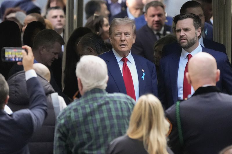 Republican presidential nominee former President Donald Trump and Republican vice presidential nominee Sen. JD Vance, R-Ohio, arrive for the 9/11 Memorial ceremony on the 23rd anniversary of the Sept. 11, 2001 terror attacks, Wednesday, Sept. 11, 2024, in New York. (AP Photo/Pamela Smith)