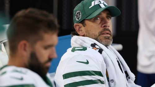 New York Jets quarterback Aaron Rodgers, right, sits on the bench during the second half of an NFL football game against the San Francisco 49ers in Santa Clara, Calif., Monday, Sept. 9, 2024. (AP Photo/Jed Jacobsohn)