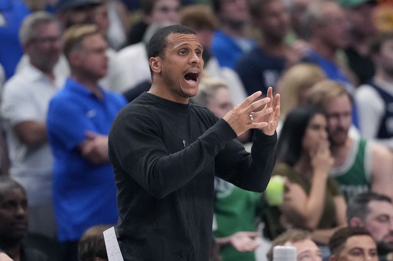 Boston Celtics head coach Joe Mazzulla signals to players during the first half in Game 4 of the NBA basketball finals against the Dallas Mavericks, Friday, June 14, 2024, in Dallas. (AP Photo/Julio Cortez)
