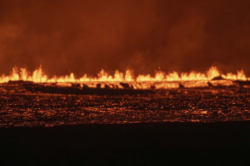 View of the lava fountains pouring out from the new eruptive fissure opened at Svartsengi volcanic system, Iceland, Thursday, Aug. 22, 2024, in a similar location as the previous eruptions. The fissure is 3 km north of Grindavik. (AP Photo/Marco di Marco)