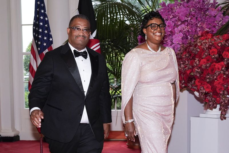 Garnett Johnson, mayor of Augusta, and Toni Seals-Johnson arrive at the White House for the state dinner on Thursday. 