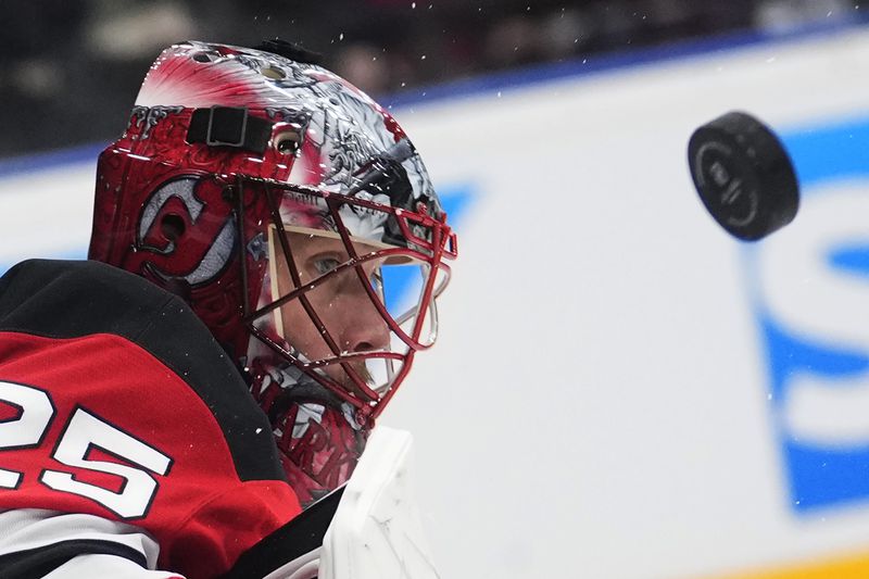 New Jersey goaltender Devils' Jacob Markstrom watches the puck during the NHL hockey game between Buffalo Sabres and New Jersey Devils, in Prague, Czech Republic, Friday, Oct. 4, 2024. (AP Photo/Petr David Josek)