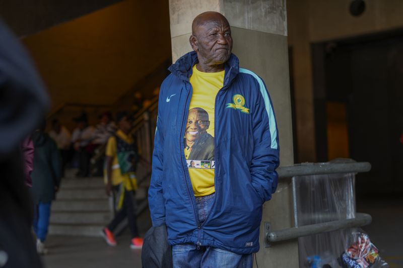 An African National Congress supporter listens to South African President Cyril Ramaphosa speak at the Siyanqoba rally at FNB stadium in Johannesburg, South Africa, Saturday, May 25, 2024. South African will vote in the 2024 general elections May 29. (AP Photo/Jerome Delay)