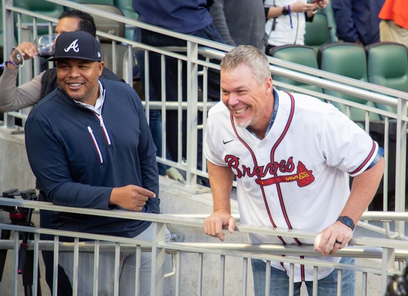   Andruw Jones (R) and Chipper Jones talk with the players before the start of the opening season game with the Cincinnati Reds at Truist Park Thursday, April 7, 2022 (Steve Schaefer / steve.schaefer@ajc.com) 