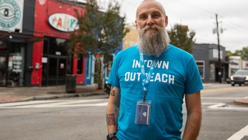 Michael Nolan, case manager for nonprofit Intown Cares, stands for a portrait in the heart of East Atlanta Village on Oct. 12, 2023. Nolan will be spearheading a new pilot program in the neighborhood to make connections with individuals experiencing homelessness and help get them housed. (Riley Bunch/riley.bunch@ajc.com)