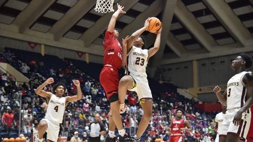 March 12, 2021 Macon - Cross Creek's Antoine Lorick (23) gets off a shot against Sandy Creek's Myles Rice (2) during the 2021 GHSA State Basketball Class AAA Boys Championship game at the Macon Centreplex in Macon on Friday, March 12, 2021 Cross Creek won 57-49 over Sandy Creek. (Hyosub Shin / Hyosub.Shin@ajc.com)