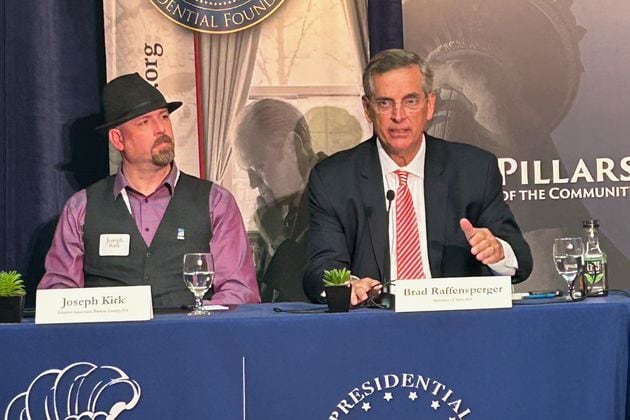 Georgia Secretary of State Brad Raffensperger and Bartow County Election Supervisor Joseph Kirk speak at a gathering of swing-state election officials in Ann Arbor, MI, on Thursday.