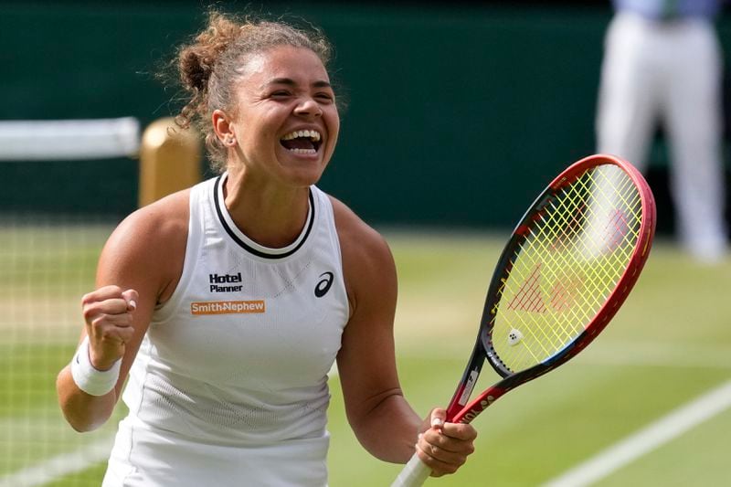 Jasmine Paolini of Italy celebrates after defeating Donna Vekic of Croatia in their semifinal match at the Wimbledon tennis championships in London, Thursday, July 11, 2024. (AP Photo/Mosa'ab Elshamy)