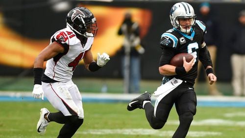 Carolina Panthers' Taylor Heinicke scrambles against the Atlanta Falcons during the second half of an NFL football game in Charlotte, N.C., Sunday, Dec. 23, 2018. (AP Photo/Mike McCarn)