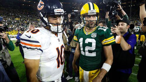 In this Sept. 9, 2018, file photo, Chicago Bears quarterback Mitchell Trubisky, left, talks to Green Bay Packers quarterback Aaron Rodgers after the Packers defeated the Bears 24-23 in an NFL football game in Green Bay, Wis. (AP Photo/Mike Roemer, File)