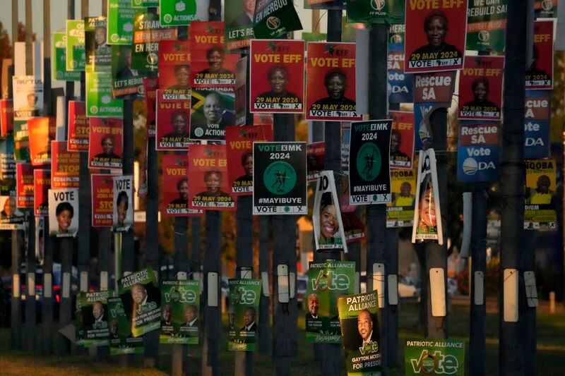 FILE — An array of election posters from various political parties are displayed on poles in Pretoria, South Africa, Thursday, May 16, 2024. Several polls have the African National Congress' support below 50% ahead of next Wednesday's, May 29, 2024 vote, raising the prospect that it might not be the majority party for the first time since Nelson Mandela led it to victory in the first all-race elections that ended white minority rule in 1994. (AP Photo/Themba Hadebe, File)
