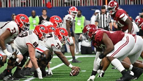 Georgia and Alabama line up at the line of scrimmage  during the second half in the SEC Championship game at Mercedes-Benz Stadium, December 2, 2023, in Atlanta. Alabama won 27-24 over Georgia. (Hyosub Shin / Hyosub.Shin@ajc.com)