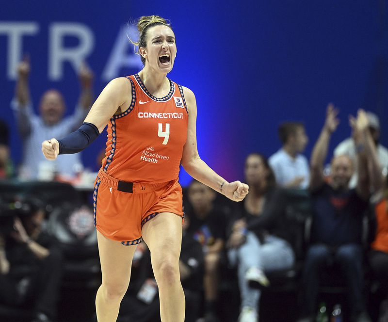 Connecticut Sun's Marina Mabrey (4) reacts to a basket during a first-round WNBA basketball playoff game against Indiana Fever at Mohegan Sun Arena, Sunday, Sept. 22, 2024. (Sarah Gordon/The Day via AP)