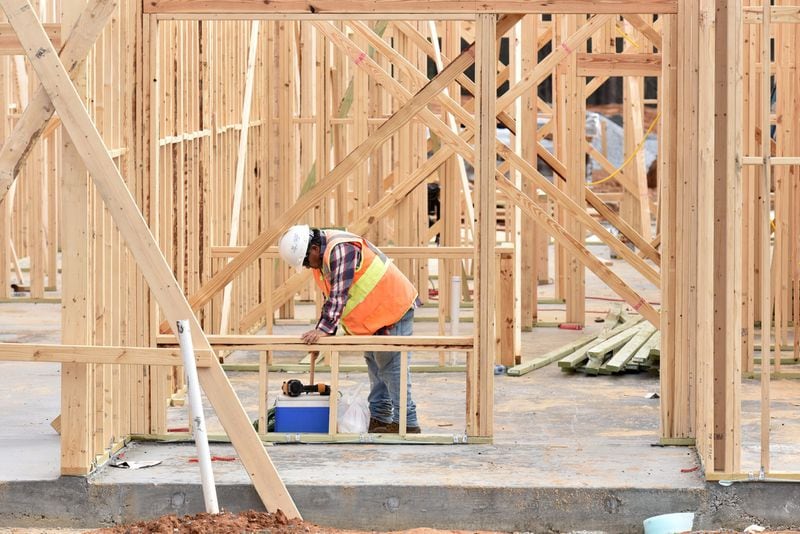 A construction worker works at the construction site of Sugarloaf Grove, a multifamily community on Duluth Highway across from the Sugarloaf Mills shopping mall, on Friday, December 27, 2019. The past decade has seen rents in metro Atlanta shoot up - but nowhere near as fast as home prices. The average here is $1,474 - up 65% from 2010, according to an analysis by RentCafe. HYOSUB SHIN/HYOSUB.SHIN@AJC.COM