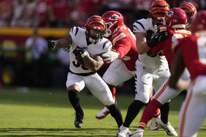 Cincinnati Bengals Chase Brown runs with the ball during the first half of an NFL football game against the Kansas City Chiefs Sunday, Sept. 15, 2024, in Kansas City, Mo. (AP Photo/Charlie Riedel)