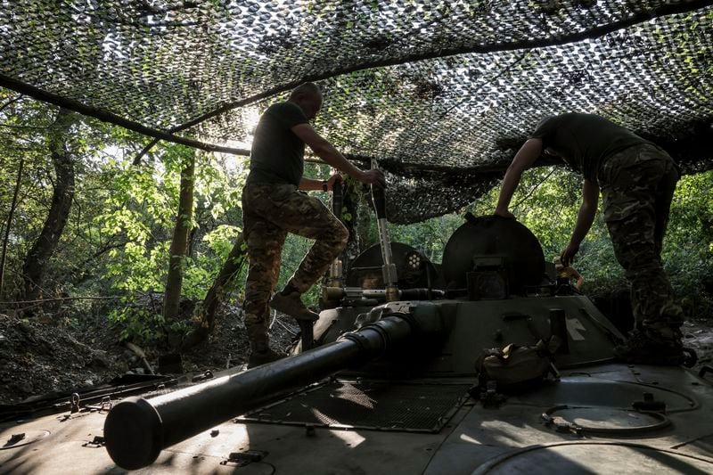 In this photo provided by Ukraine's 24th Mechanised Brigade press service, servicemen of 24th mechanised brigade prepare to fire BRM1k infantry fighting vehicle towards Russian positions near Chasiv Yar town, in Donetsk region, Ukraine, Aug. Saturday 17, 2024. (Oleg Petrasiuk/Ukrainian 24th Mechanised Brigade via AP)