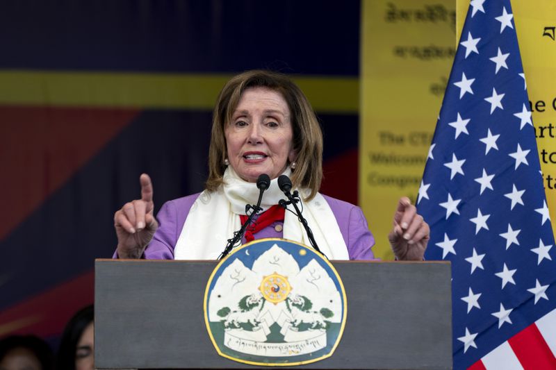 Democratic former House Speaker Nancy Pelosi gestures as she speaks at a public event during which a US delegation led by Republican Rep. Michael McCaul was felicitated by the President of the Central Tibetan Administration and other officials at the Tsuglakhang temple in Dharamshala, India, Wednesday, June 19, 2024. (AP Photo/Ashwini Bhatia)