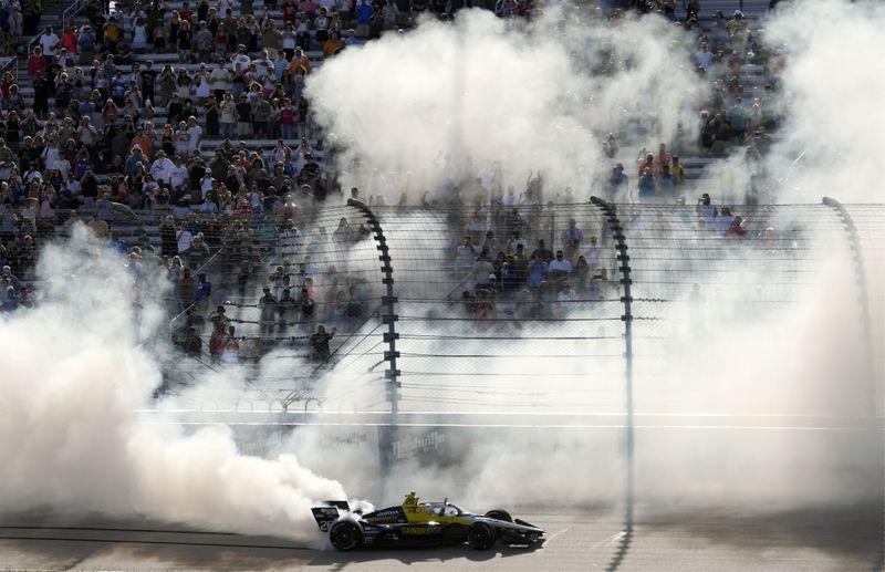 Colton Herta celebrates after winning an IndyCar auto race Sunday, Sept. 15, 2024, at Nashville Superspeedway in Lebanon, Tenn. (AP Photo/Mark Humphrey)