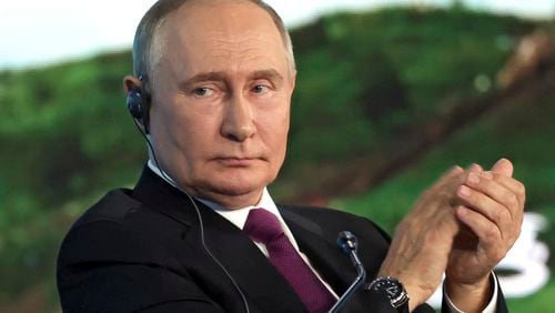 Russian President Vladimir Putin applauds during the plenary session of the Eastern Economic Forum in Vladivostok, Russia, Thursday, Sept. 5, 2024. (Vyacheslav Prokofyev, Sputnik, Kremlin Pool Photo via AP)