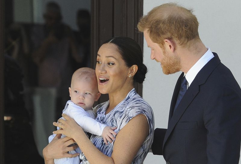 FILE - Britain's Prince Harry and Meghan, Duchess of Sussex, holding their son Archie, meet with Anglican Archbishop Emeritus, Desmond Tutu, and his wife Leah in Cape Town, South Africa, Wednesday, Sept. 25, 2019. (Henk Kruger/Pool via AP, Pool, File)