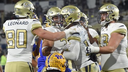 December 10, 2020 Atlanta - Georgia Tech's quarterback Jeff Sims (10) celebrates with teammates after he scored a touchdown during the first half of an NCAA college football game at Georgia Tech's Bobby Dodd Stadium in Atlanta on Thursday, December 10, 2020. (Hyosub Shin / Hyosub.Shin@ajc.com)