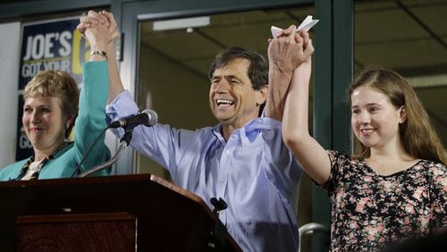 In this April 26, 2016, file photo, former Congressman Joe Sestak, center, his wife Susan Sestak, left, and daughter Alex Sestak react after speaking to supporters gathered outside his campaign headquarters in Media, Pa.