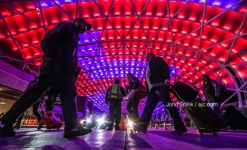 The north canopy at Hartsfield-Jackson International Airport lights up to welcome visitors to Atlanta for the Super Bowl. After some early showers, Atlanta is expected to be dry and warm Sunday afternoon, according to Channel 2 Action News.