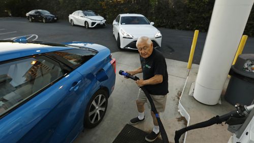 Richard Wong fills his hydrogen-fueled vehicle at a station in Irvine, California. A coalition of Georgia political, business and clean energy leaders are seeking to bring a new regional hydrogen hub to Georgia and the Southeast. (Carolyn Cole/Los Angeles Times/TNS)