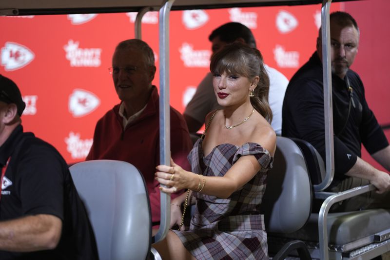 Taylor Swift arrives before the start of an NFL football game between the Kansas City Chiefs and the New Orleans Saints Monday, Oct. 7, 2024, in Kansas City, Mo. (AP Photo/Charlie Riedel)