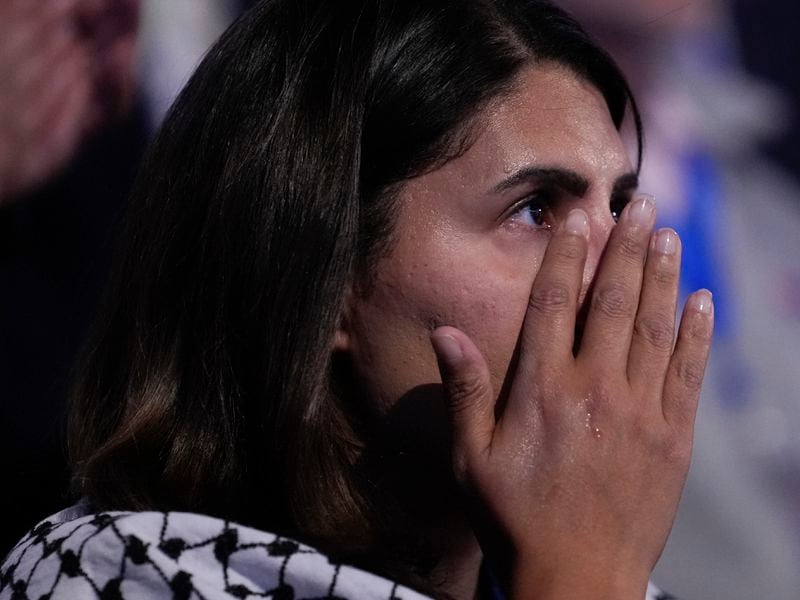 A woman reacts to Jon Polin and Rachel Goldberg, parents of hostage Hersh Goldberg-Polin speaking during the Democratic National Convention Wednesday, Aug. 21, 2024, in Chicago. (AP Photo/Charles Rex Arbogast)