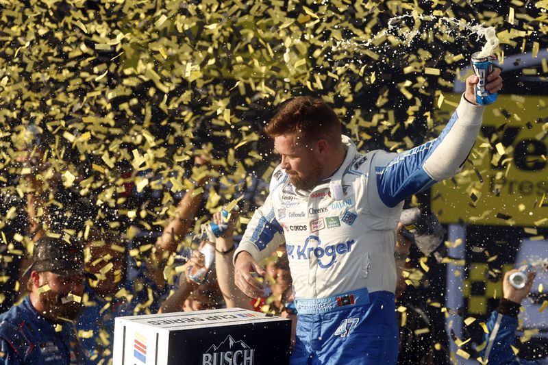 Driver Ricky Stenhouse Jr. celebrates in Victory Lane after a NASCAR Cup Series auto race at Talladega Superspeedway, Sunday, Oct. 6, 2024, in Talladega, Ala. (AP Photo/ Butch Dill)