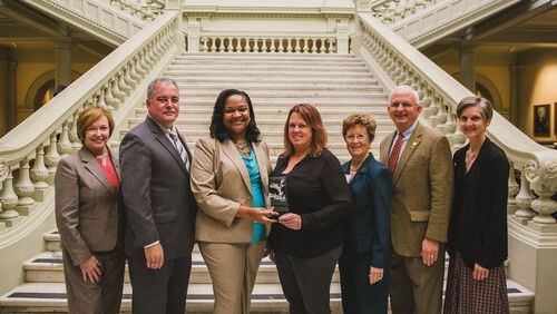 From left, Public Health Commissioner Dr. Brenda Fitzgerald, State School Superintendent Richard Woods, Fayette County School Nutrition Director Kokeeta Wilder, Fayette County School Nutrition Lead Manager Ginger McCann, Fayette County Master Gardener Sandy Golden, Commissioner of Agriculture Gary Black, and Georgia Organics Executive Director Alice Rolls at the Georgia State Capitol for the 2016 Golden Radish Award ceremony.